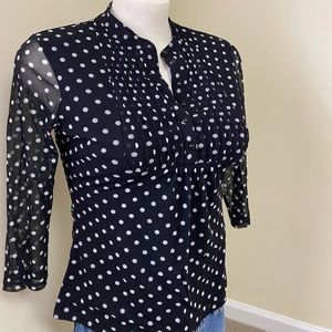 INC polka dotted top.